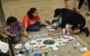 Students from the Global Student Friendship Center paint international flags on their crown. Photo Chuck Thomas/ODU